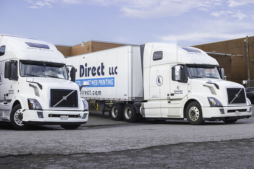 Two Tidewater Direct LLC shipping trucks.
